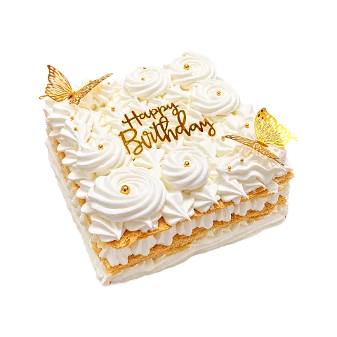 Cake de Señorita blanco con rosetones de merengue, mariposas doradas y letrero Happy Birthday, Will & Mill